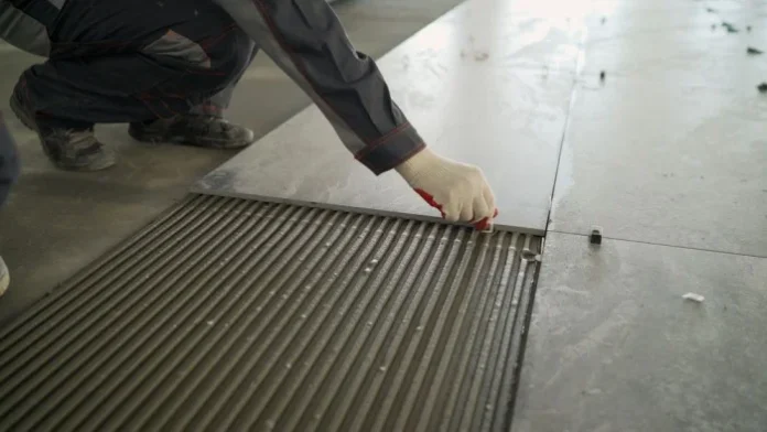 how to remove adhesive from floor tiles